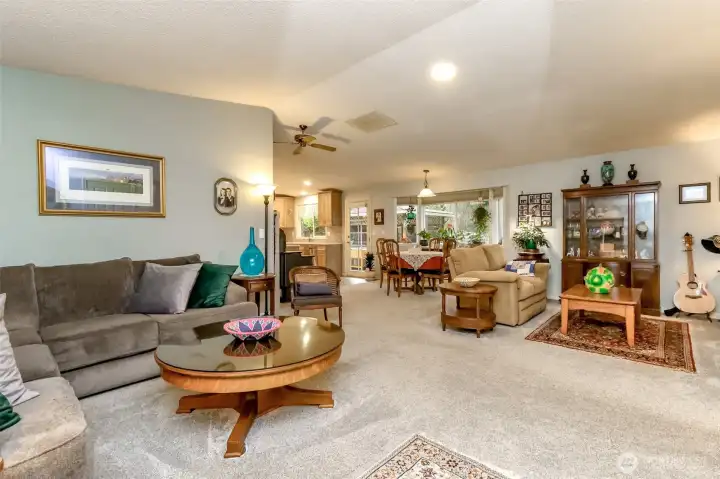 Enter into a great room with vaulted ceilings that creates an inviting atmosphere.