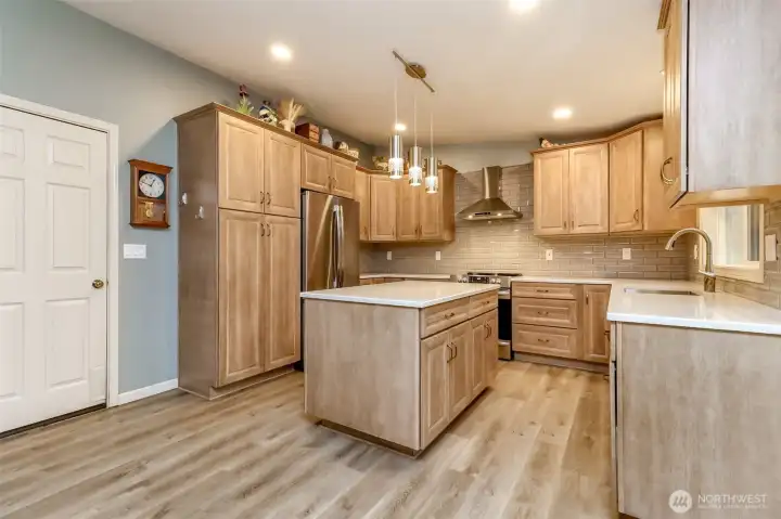 The large chefs' kitchen is perfect for culinary creations. The home comes with a whole-house water filtration system.