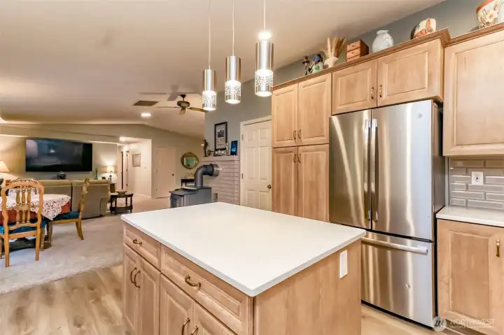 The elegant quartz counters and plenty of cupboard space are a bonus in this large kitchen.