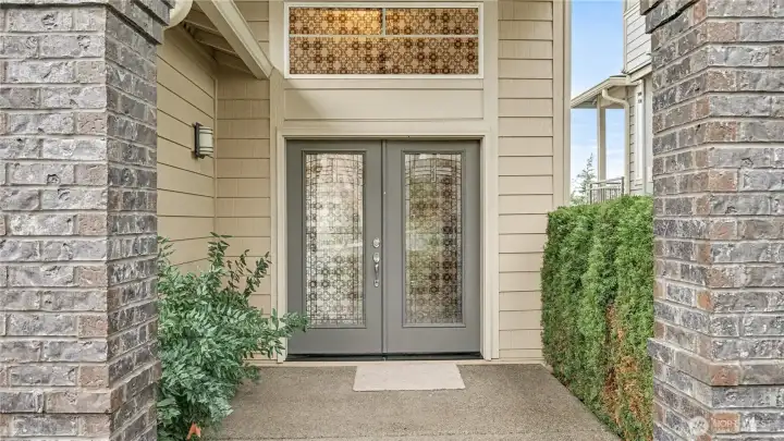 Enjoy stunning curb appeal with classic brick detailing & elegant double glass doors.