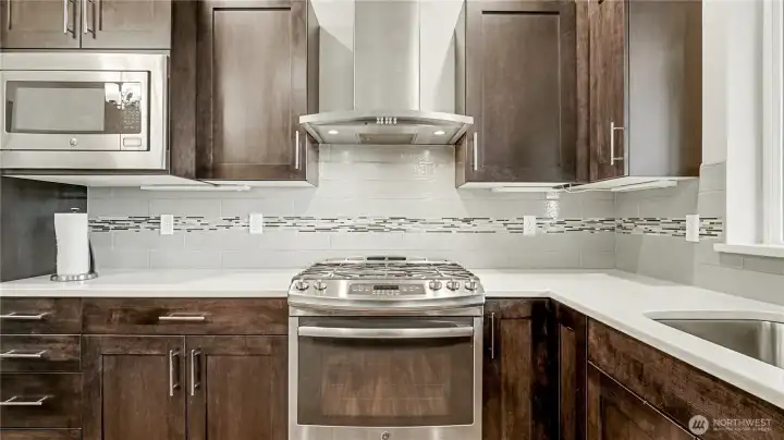 Kitchen also offers plenty of cabinet and counter space.