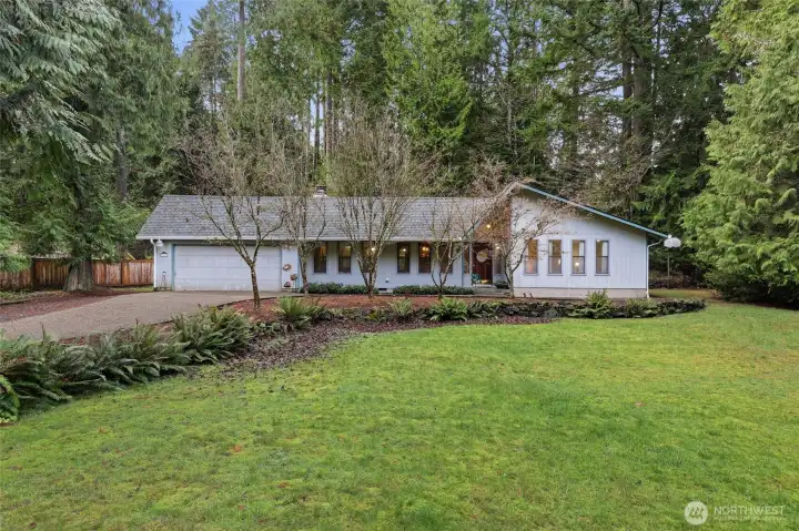 PNW Dream--large lot, open space, lush greenery; a quality-built home in winding, mature neighborhood off Eld Inlet! The row of trees in front are Flowering Dogwoods--STUNNING blooms every spring/summer!