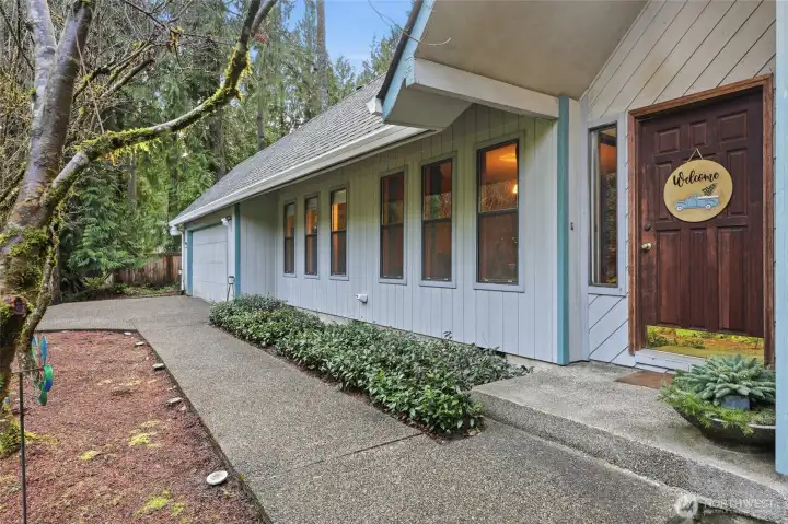 Vaulted porch is stylish and inviting; while new roof and gutters provide great protection and peace of mind.