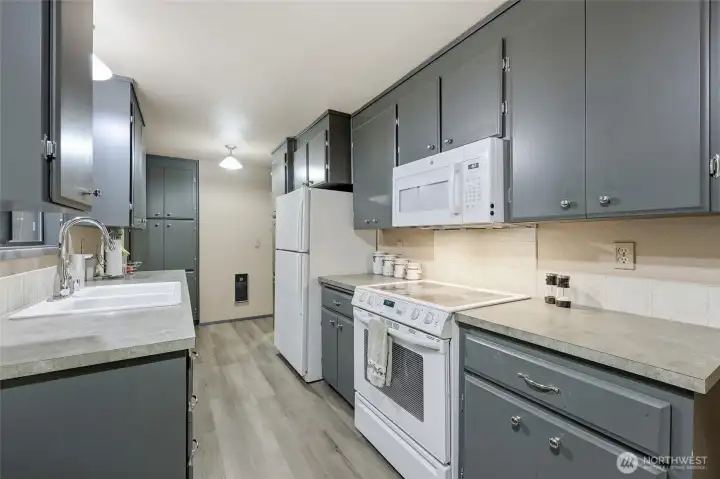 With terrific storage, pleasant workspace, and access from three points in the house, this kitchen is truly the heart of the home.