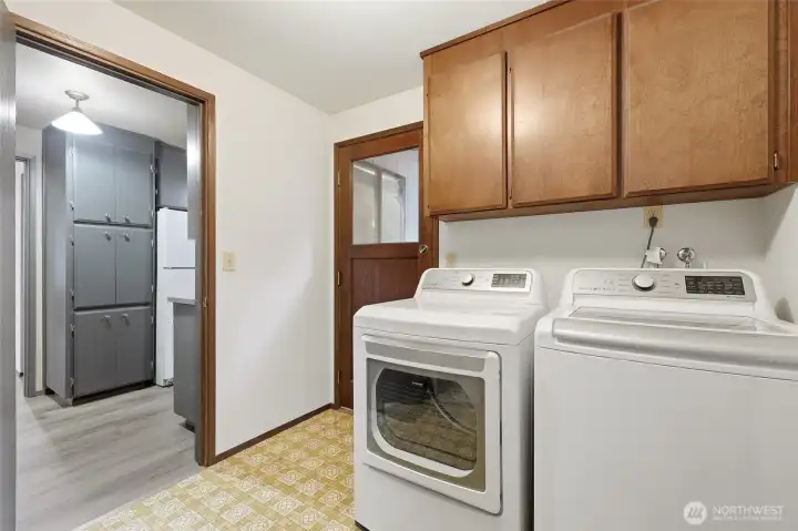 With access to the back yard, this is a perfect "mudroom" space for ingress and egress, as well as handling your laundry and adding easy storage.