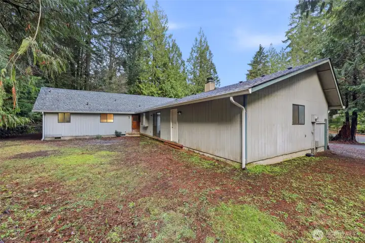The white door is access to the garage, the slider leads to the family room, and the brown door provides entry to the laundry room--each one with its individual benefits and convenience!