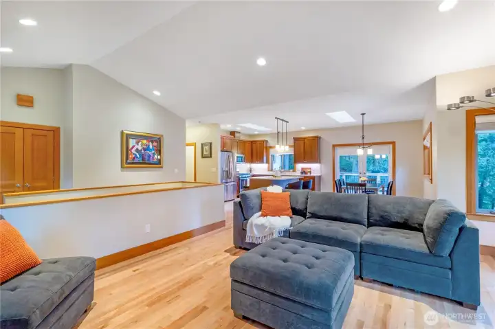 Spacious living room with hardwood floors and large windows