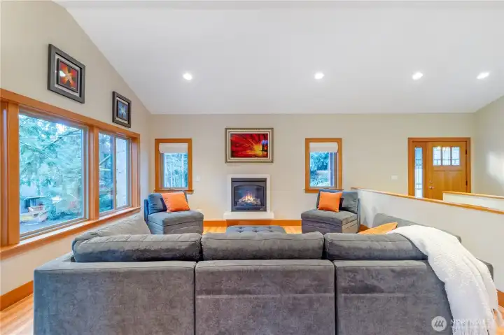 Alternate view of living room with fireplace and open sightlines