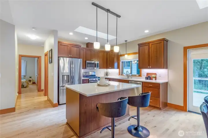Kitchen with large island, breakfast bar seating, and ample counter space