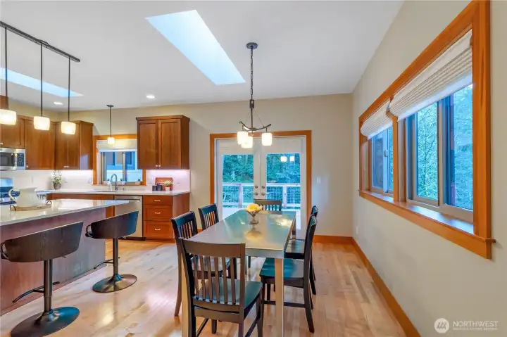 Dining area with access to deck and natural light Dining area with access to deck and natural light