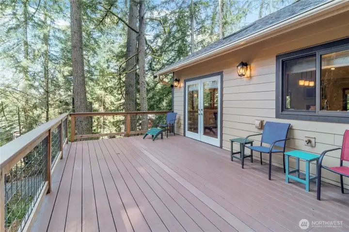 Extended deck view with peaceful wooded surroundings Extended deck view with peaceful wooded surroundings