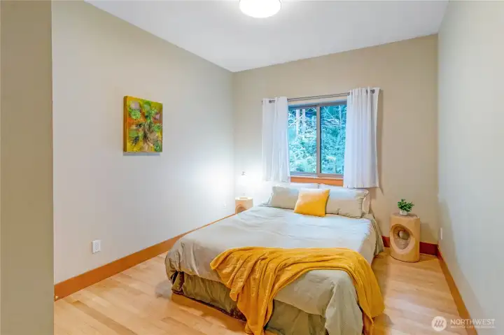 Secondary bedroom with natural light and closet