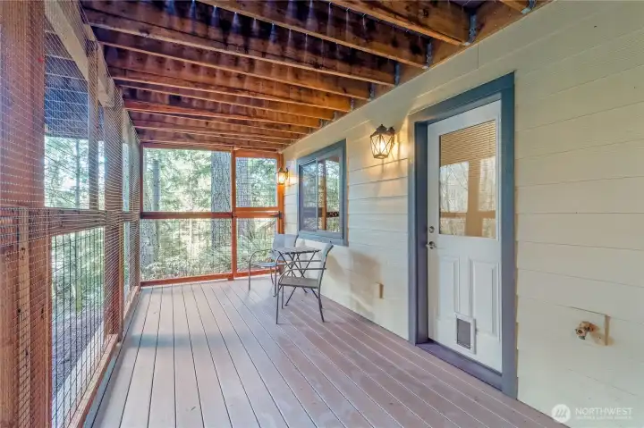 Enclosed lower deck providing protected outdoor space Enclosed lower deck providing protected outdoor space