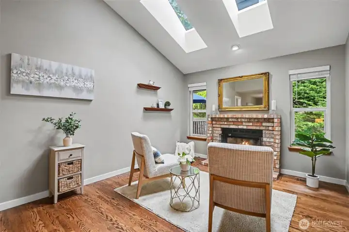 Bright and light living room featuring a gas fireplace.