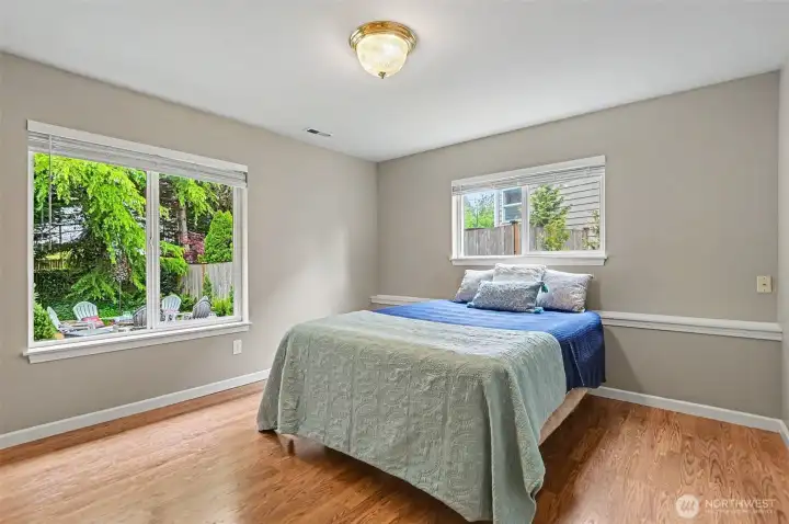 Lower level primary suite with a walk-in closet and bathroom.
