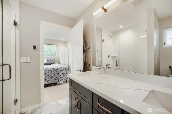 Primary bath with shower and heated floor.