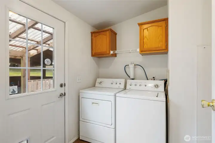Back entry mudroom with washer and dryer.