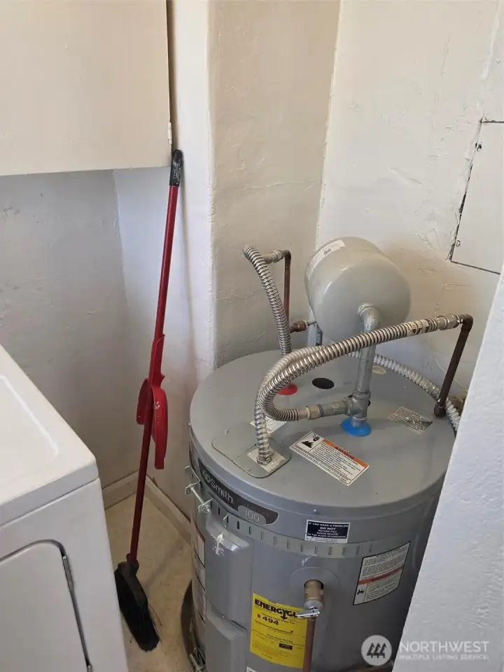 Hot water tank.  Note hurricane straps and drain pan. It's legal.