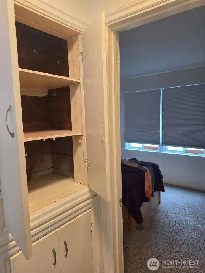Showing shelfs in the storage closet.