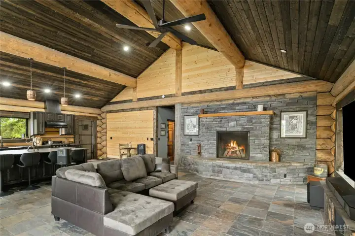 A photo of the living room with a huge wood fire place to cozy up to on winter days. A photo of the living room with a huge wood fire place to cozy up to on winter days.