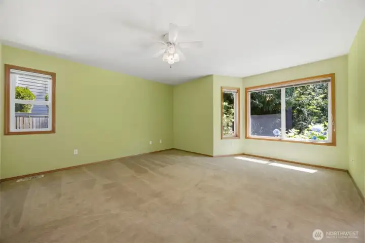 Primary bedroom with view of the backyard Primary bedroom with view of the backyard