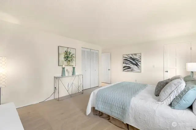 The spacious primary suite features two closets (one is walk-in), water views from the windows and a wood-burning FP. Electricity is adjacent to the FP which could allow the future owner an opportunity for an electric fireplace.