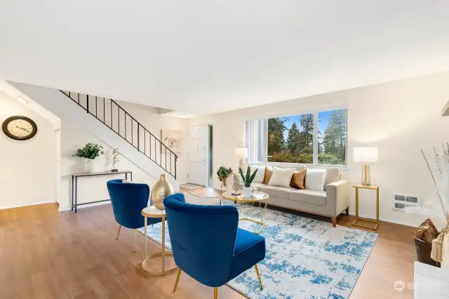 Spacious living room with wood fireplace.