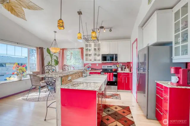 Kitchen with breakfast bar and eating area.