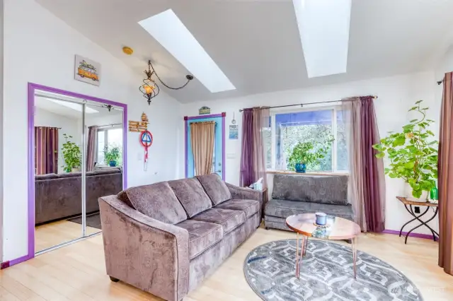 Living room.  Two skylights above in vaulted ceiling.