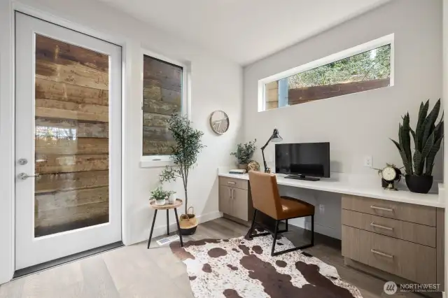 Lovely built in office space on the great room level but tucked away for privacy