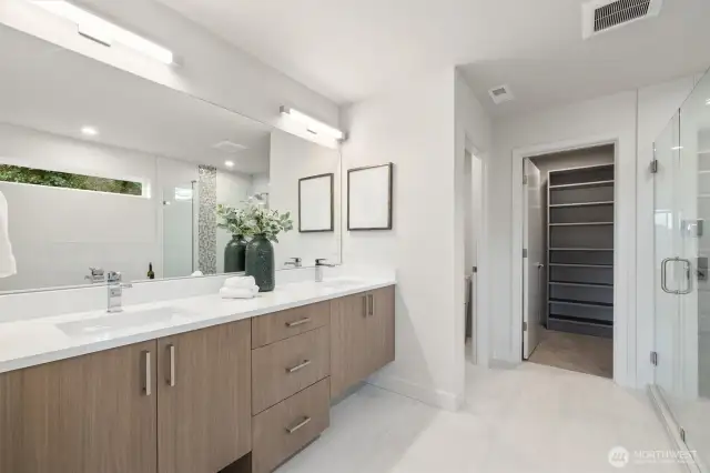 Double sinks, look over to the walk in closet
