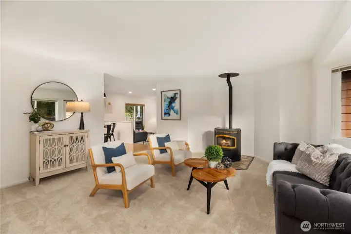 Enter into your immaculate living room complete with new paint and carpet. Stay cozy on autumn evenings with this pellet stove.