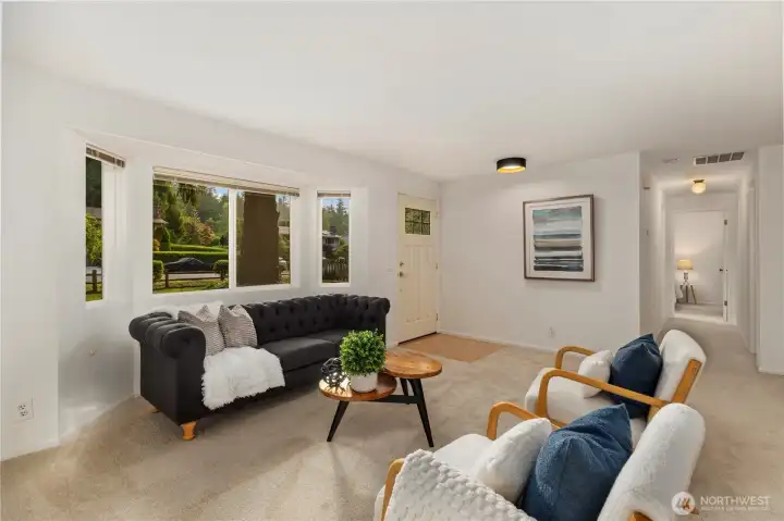 From the living room, the heart of the home, head down to the bedroom wing of the house or over to the family room and kitchen.