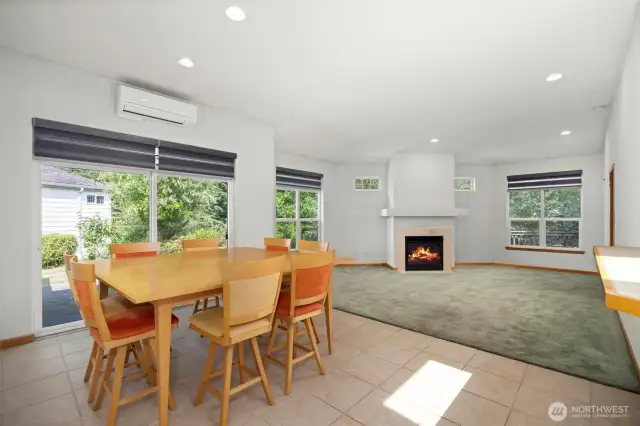 The dining area is open to the living room and kitchen and has a large glass sliding door onto the spacious patio on the west side of the unit.