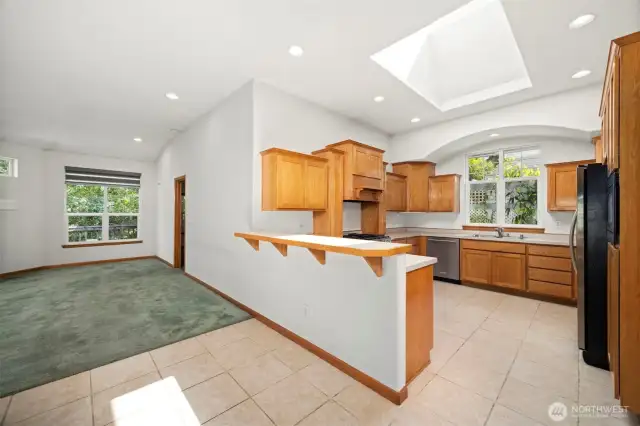 The kitchen is quite spacious and has an abundance of cabinets and counter space.