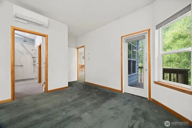 The primary suite is privately situated off the living area and separate from the other bedroom.