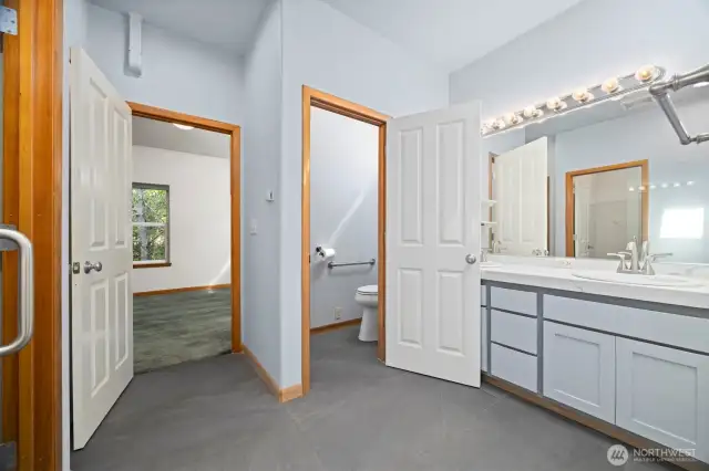 The primary bath has a linen storage closet and a separate toilet room.