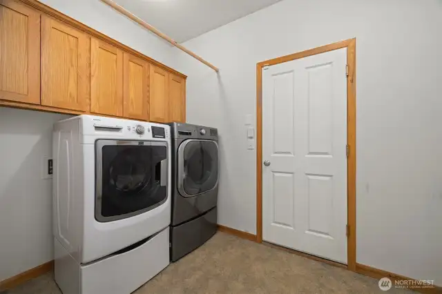 The laundry room opens to the single-vehicle garage.