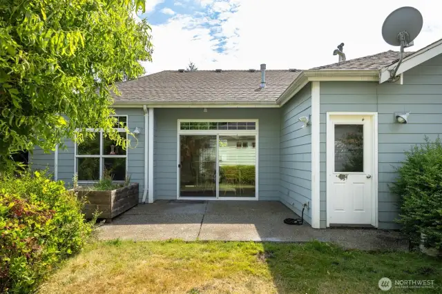 There is a spacious patio off the dining room and a door from the garage, too.