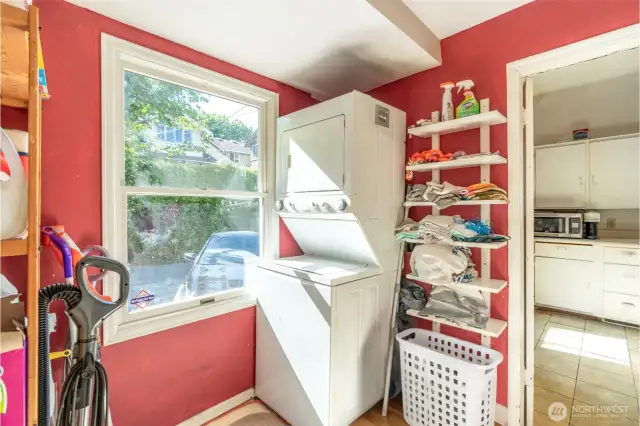 Laundry room in the back off the kitchen on the main floor that heads to the side yard or down into the basement.