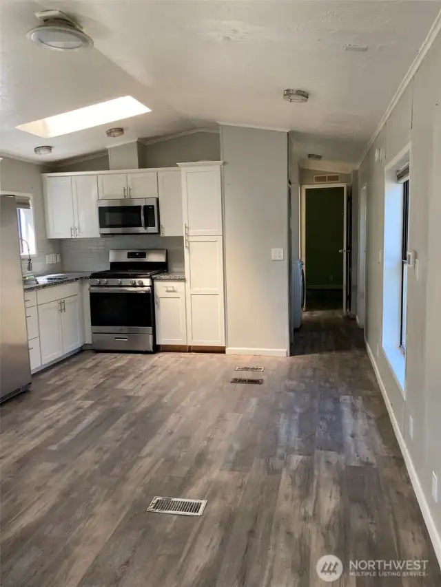 View from living into kitchen / down hall