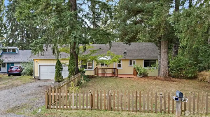 Charming picket fenced front yard!