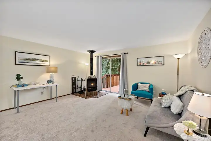 Spacious living room with a woodstove on the corner