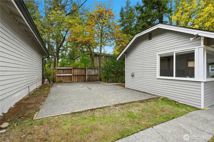 Patio space between the hone and garage.