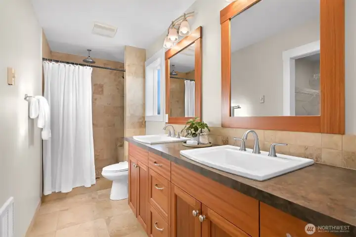 Primary bathroom with double sinks and huge walk in closet.