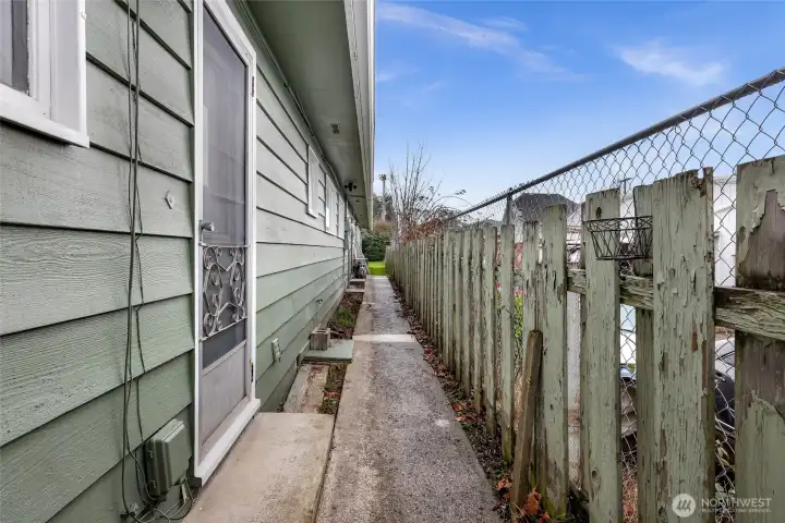 Back door porches and walkway along property line to carport.