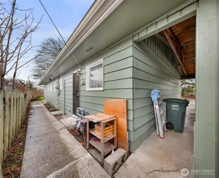 Separate Utilities - Another view of the back porches and walkway into the carport seen to your right.
