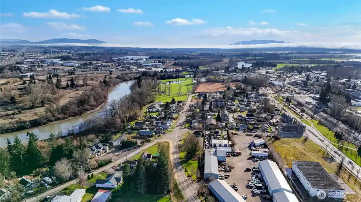 Cedar St seen below left by the Nooksack River has seen extensive revitalization recently.  Storm water is at the junction of Portal/Cedar/Eaton - Contact the City of Ferndale Planning Dept for MXD Zoning non-conforming uses for 1954 Eaton Ave or friendly listing agent!
