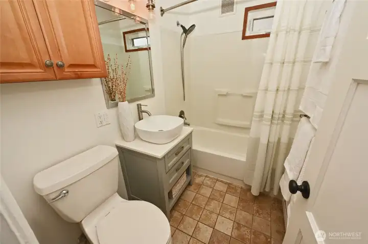 Main floor bath with tile floor.