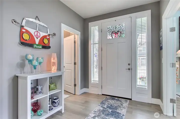 The entryway makes an immediate impression, bright, spacious, and beautifully wide, with a long, welcoming flow that draws you in. Filled with natural light, it sets the tone from the moment you arrive, offering an inviting sense of openness that instantly feels like home.